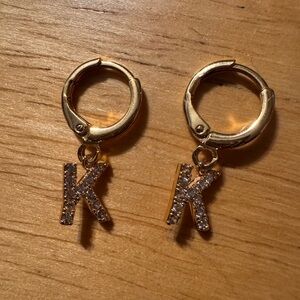 Gold Tone Huggie Rhinestone K Earrings